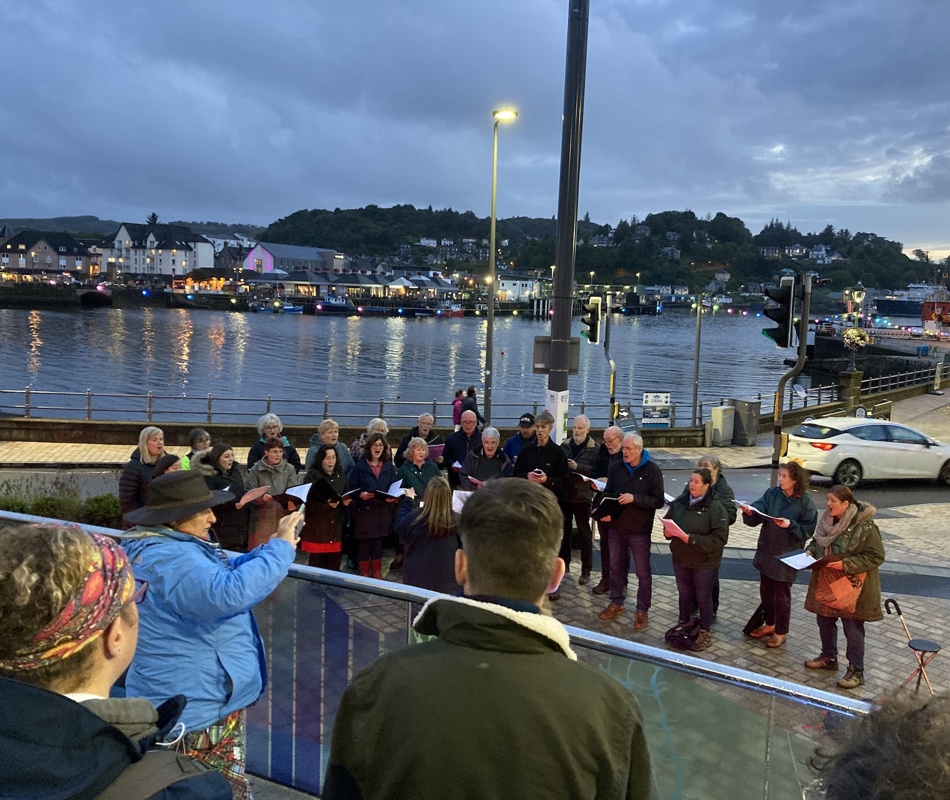 Oban Gaelic Choir's Outdoor Concert, At George Street Square In Oban, 2021. As Part Of On Tidal Zones Residency Hosted By ATLAS Arts And CLIMAVORE. Credit Naoko Mabon